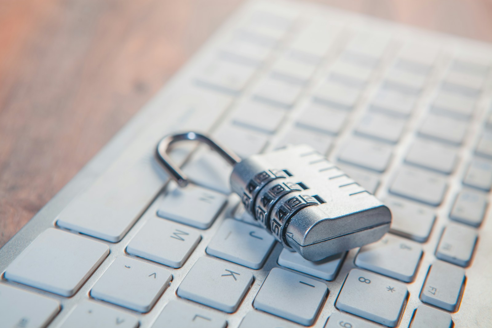 The Offline Fortress: Hardening Your Life with KeePassXC A combination lock rests on a computer keyboard.